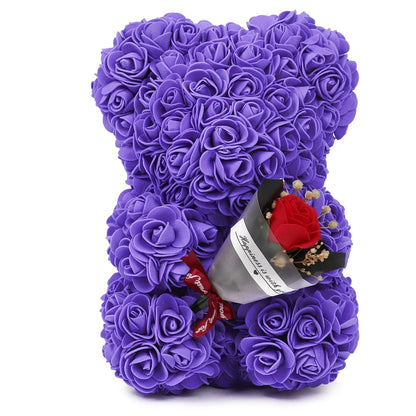 Artificial rose bear holding a bouquet